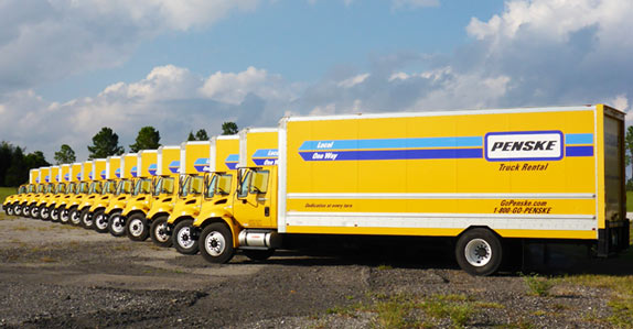 A fleet of Penske box trucks.