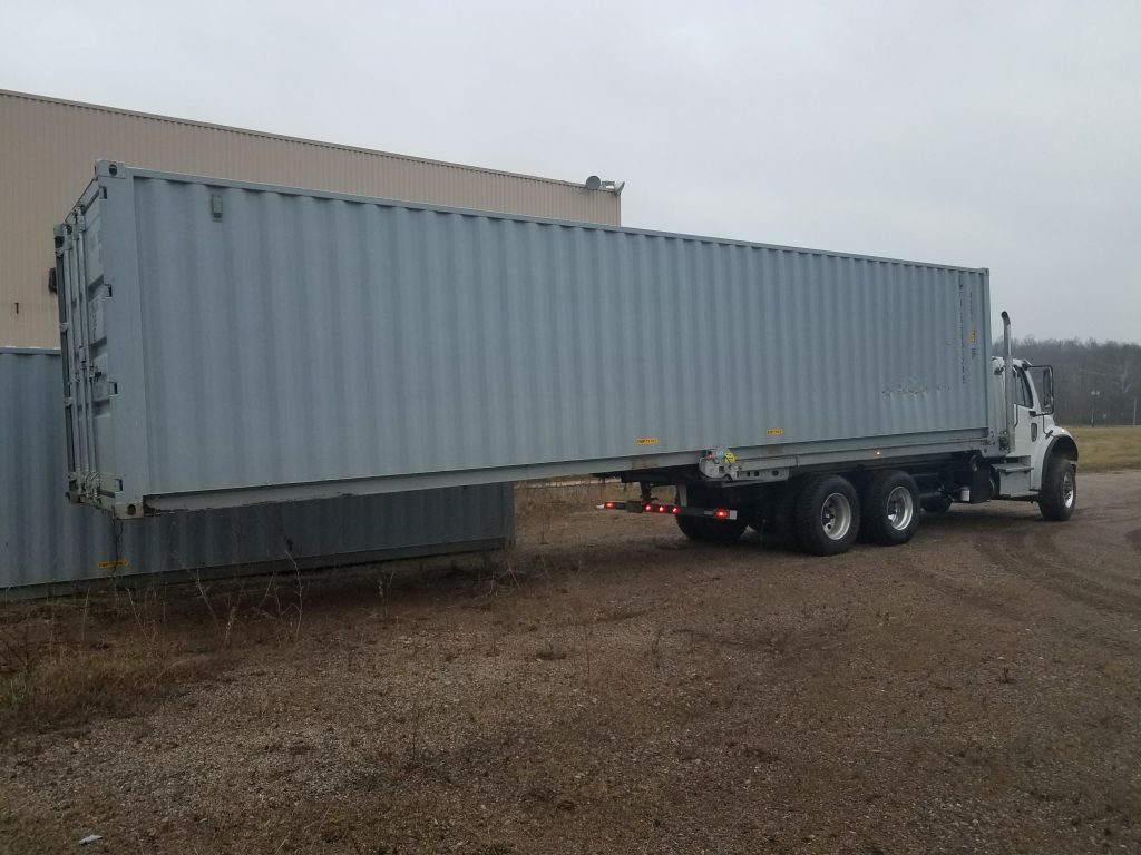 A 20' QuickLoadz truck bed loaded with a 40' trailer. It's one tough truck!